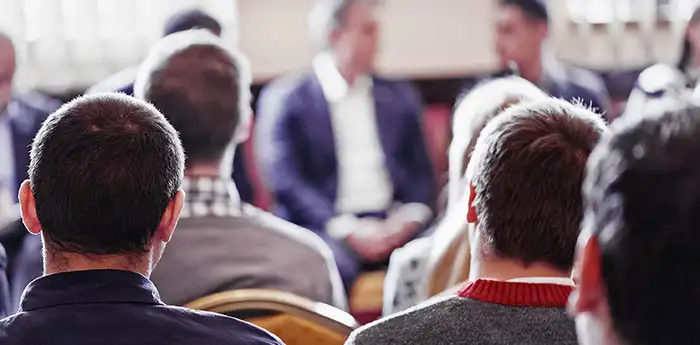 A group of men at a gathering.