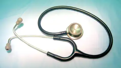 A close up of a stethoscope on a blue background
