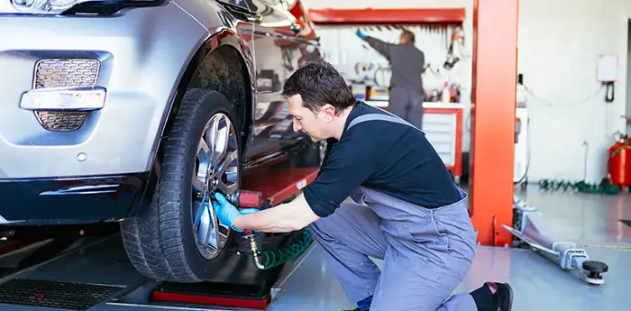 Mechanic working on a tire.