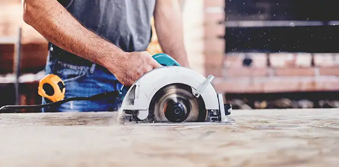 Man using a circular saw.
