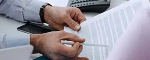 Man going over documents with a client.
